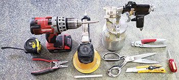 A variety of tools used in the shop for upholstery.